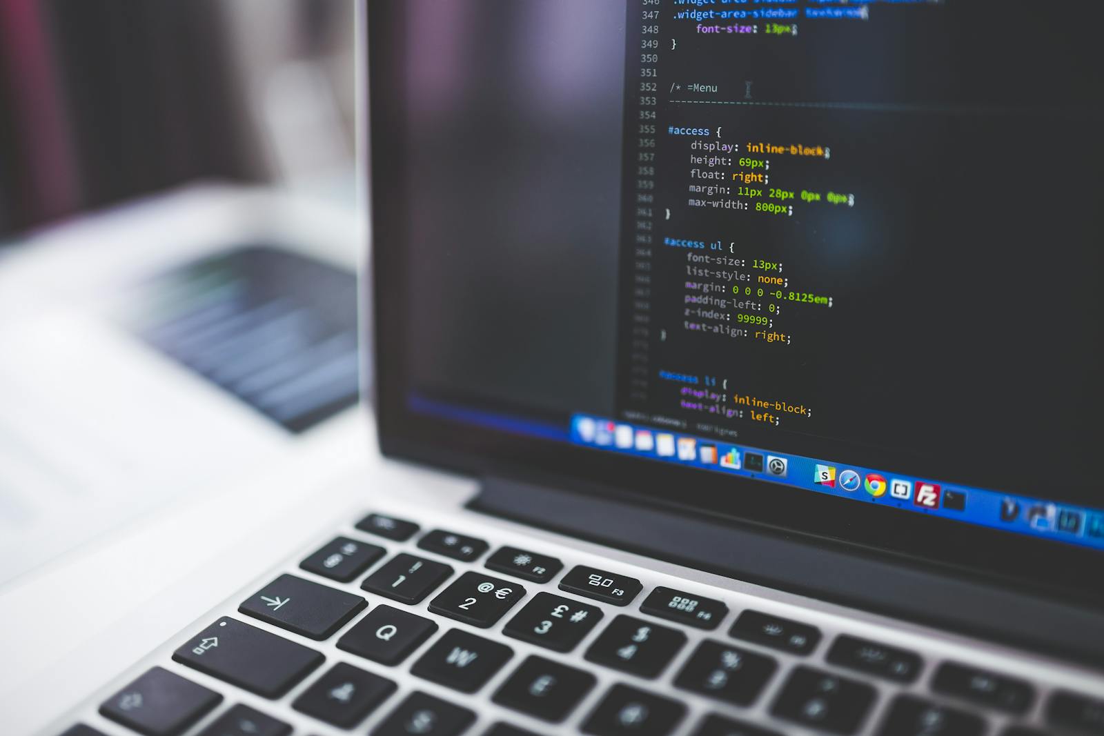 MacBook displaying CSS code in a code editor — photo by negativespace on Pexels