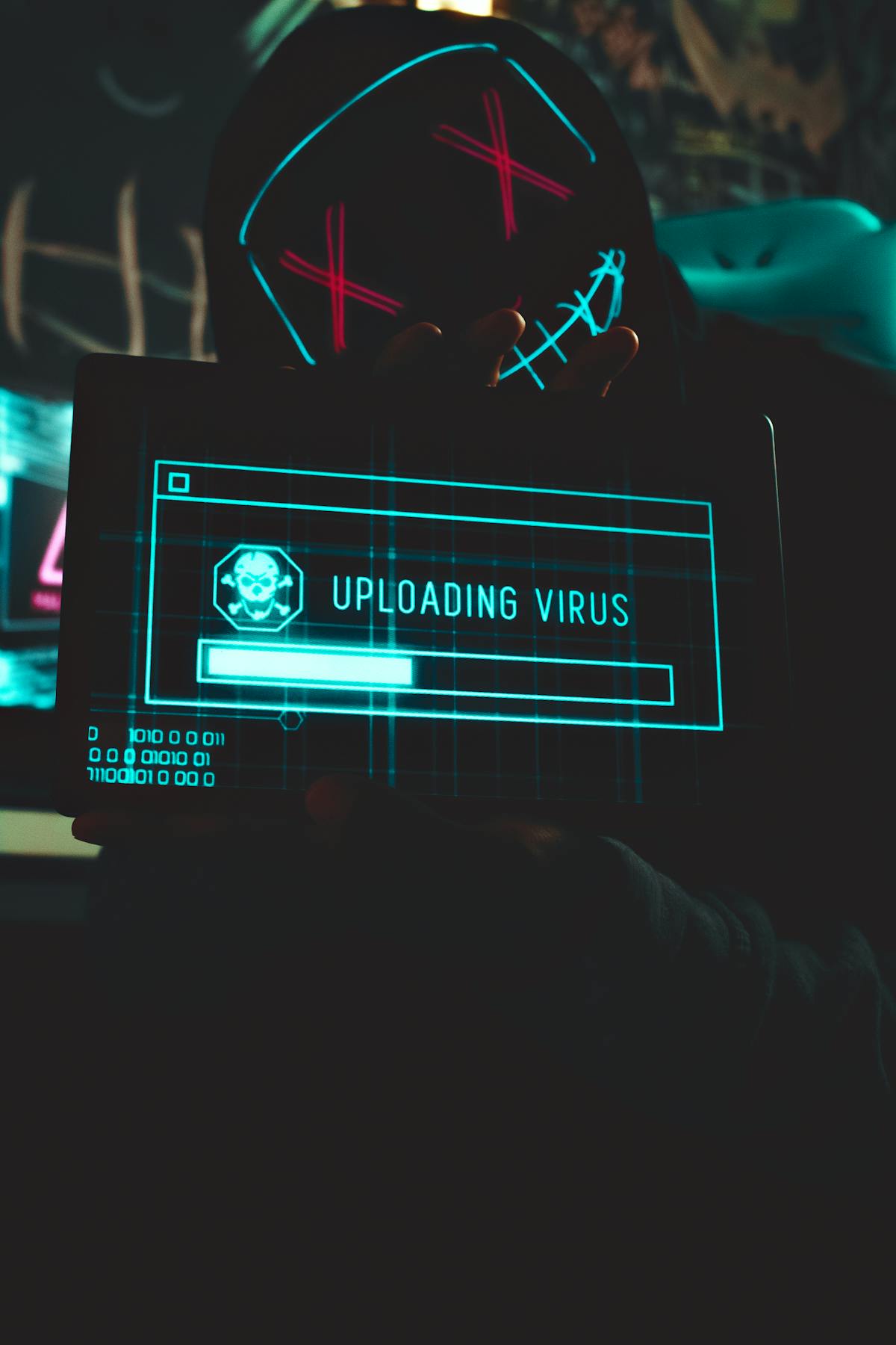 Hooded figure with neon mask holding tablet displaying 'Uploading Virus' progress bar — visualizing the DOLLY WordPress mu-plugin backdoor exfiltrating credentials