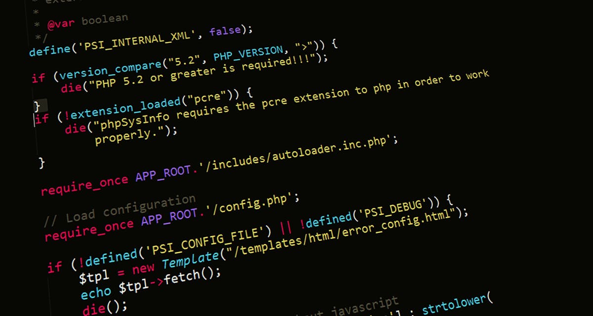 Close-up of PHP source code displaying version_compare("5.2", PHP_VERSION) check and require_once includes — typical PHP version handling code (photo: Pixabay / Pexels)