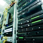 Rack of running 1U servers in a data center, multi-color network cables