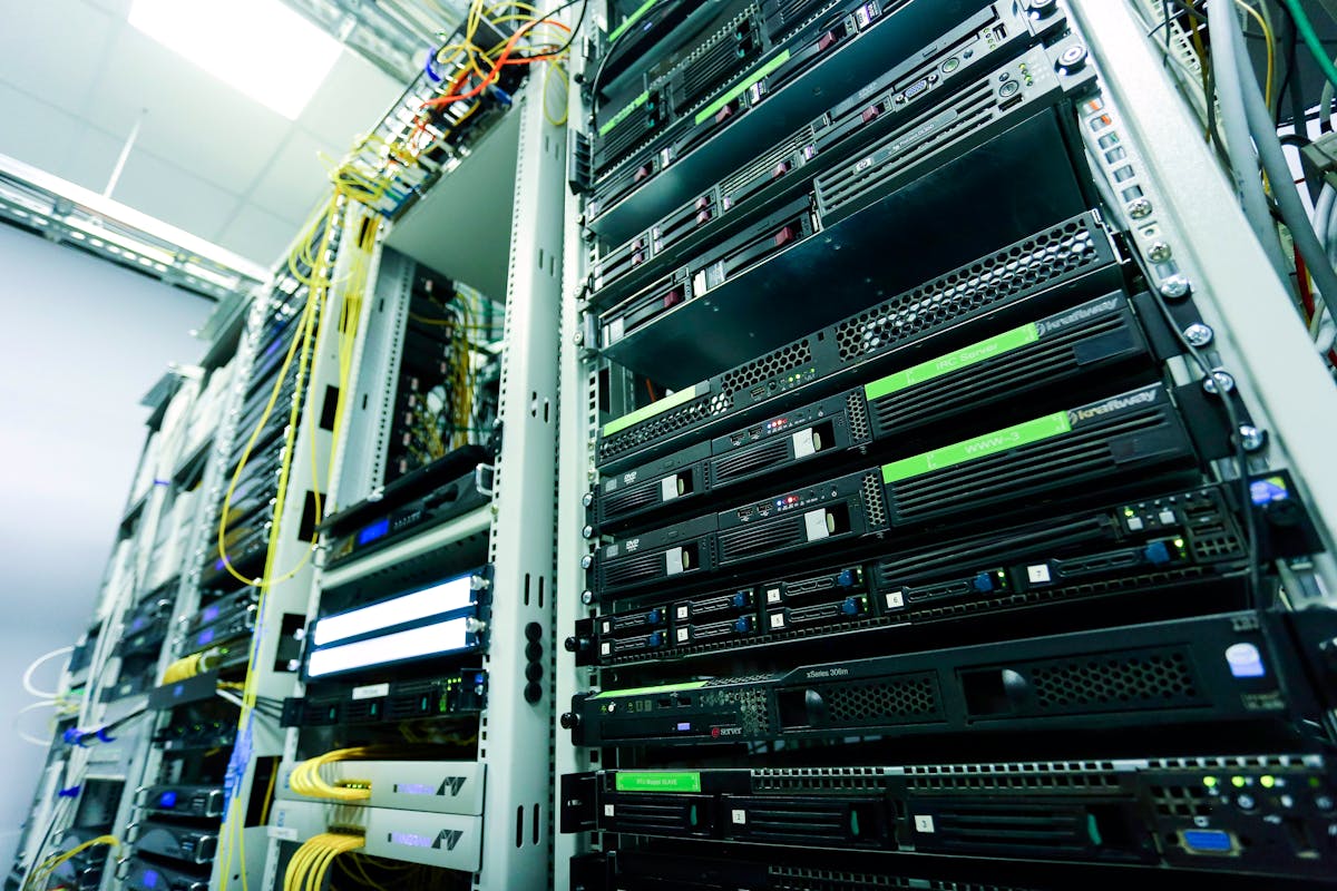 Rack of running 1U servers in a data center, multi-color network cables
