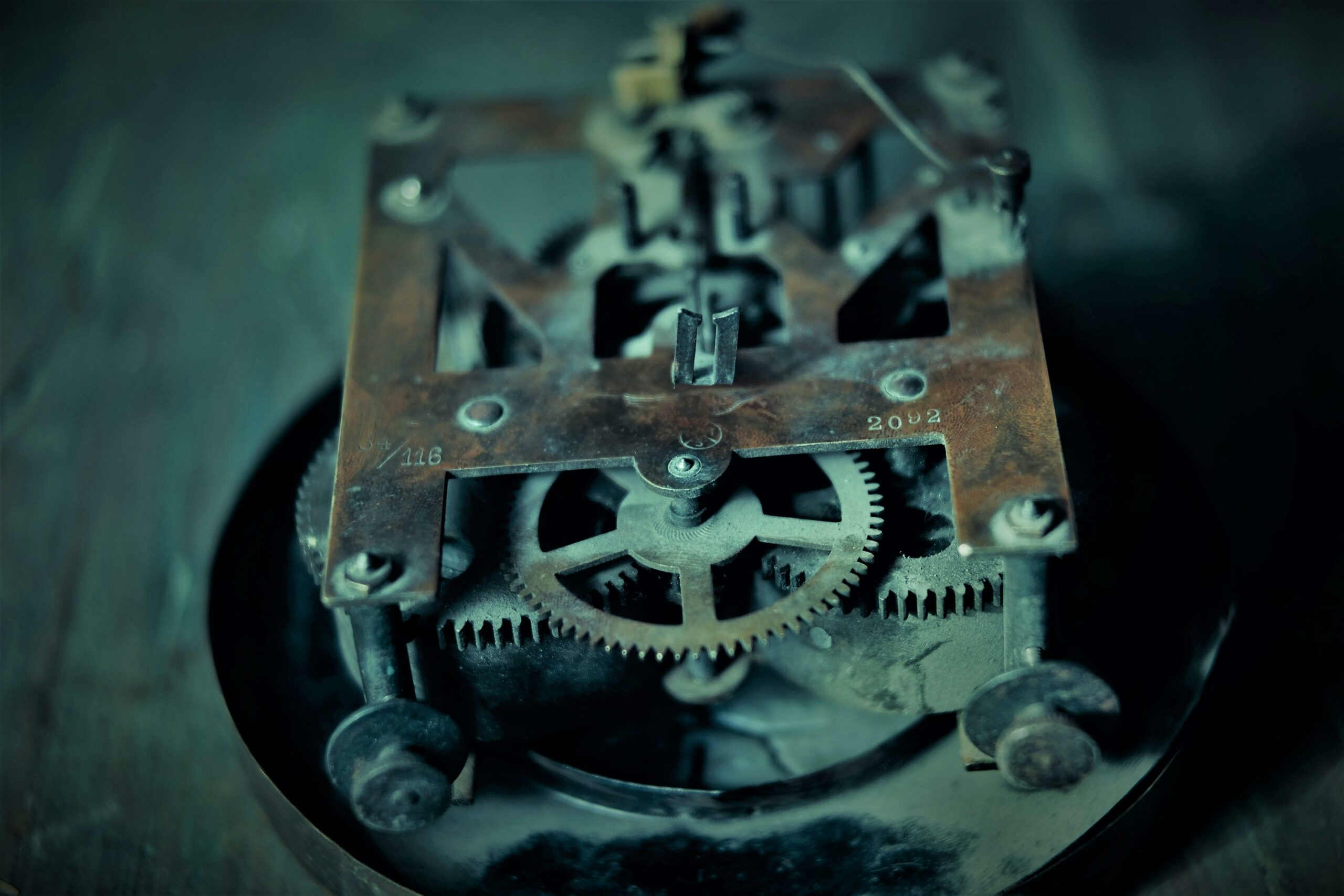 Close-up of an old mechanical clock movement and gears — photo by dof-pinhole on Pexels