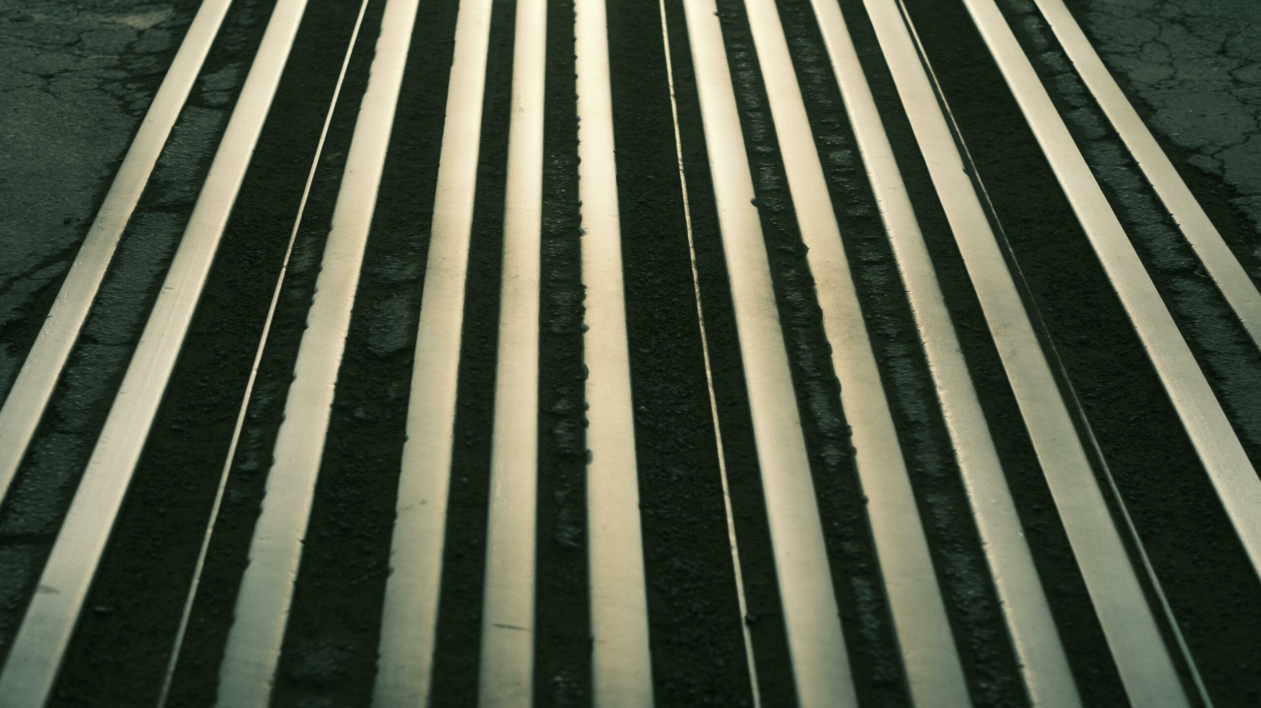 Parallel metal rails or bars in perspective — photo by uppsychic on Pexels