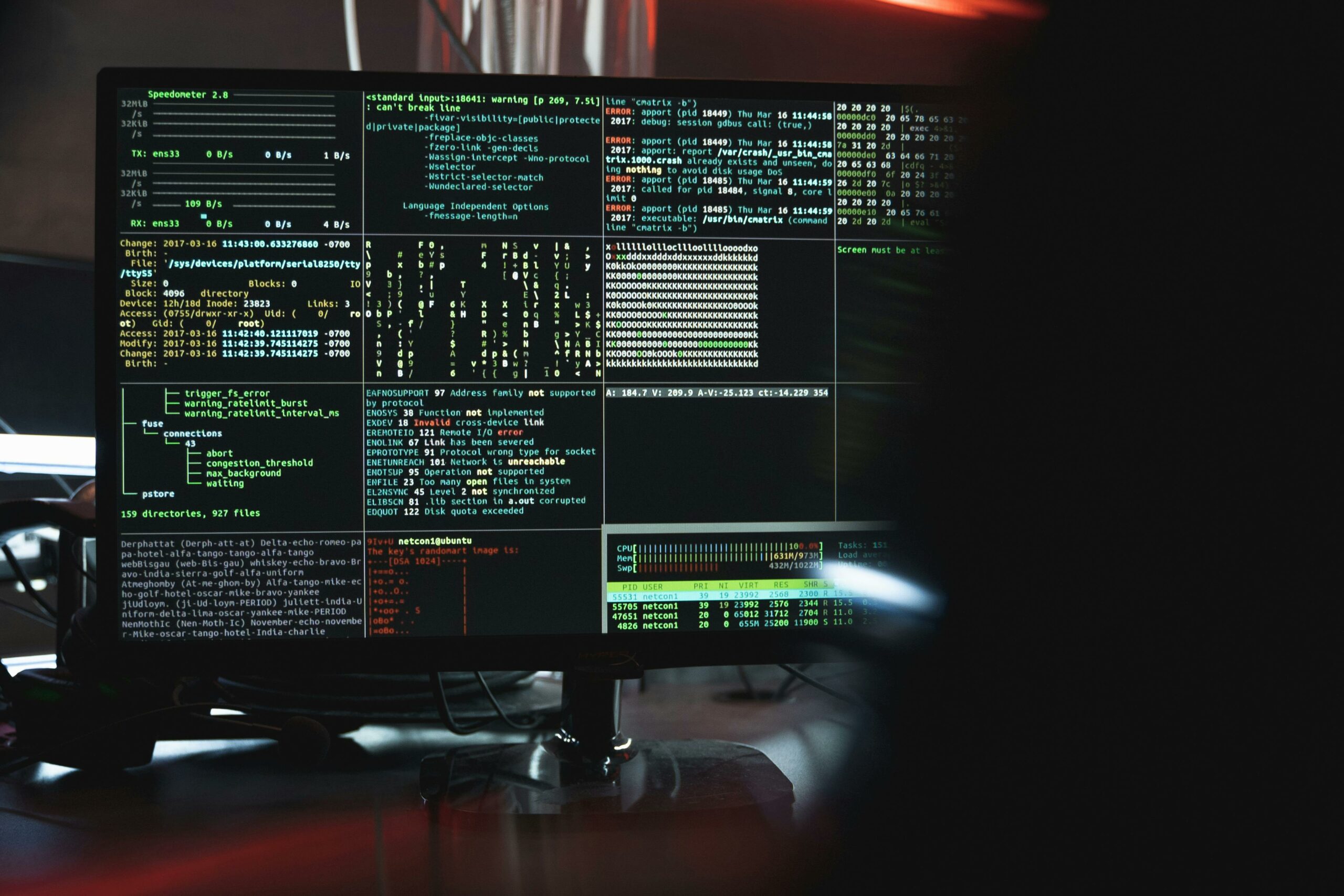 Multi-pane terminal session showing log output and system monitoring on a dark monitor — photo by Tima Miroshnichenko on Pexels