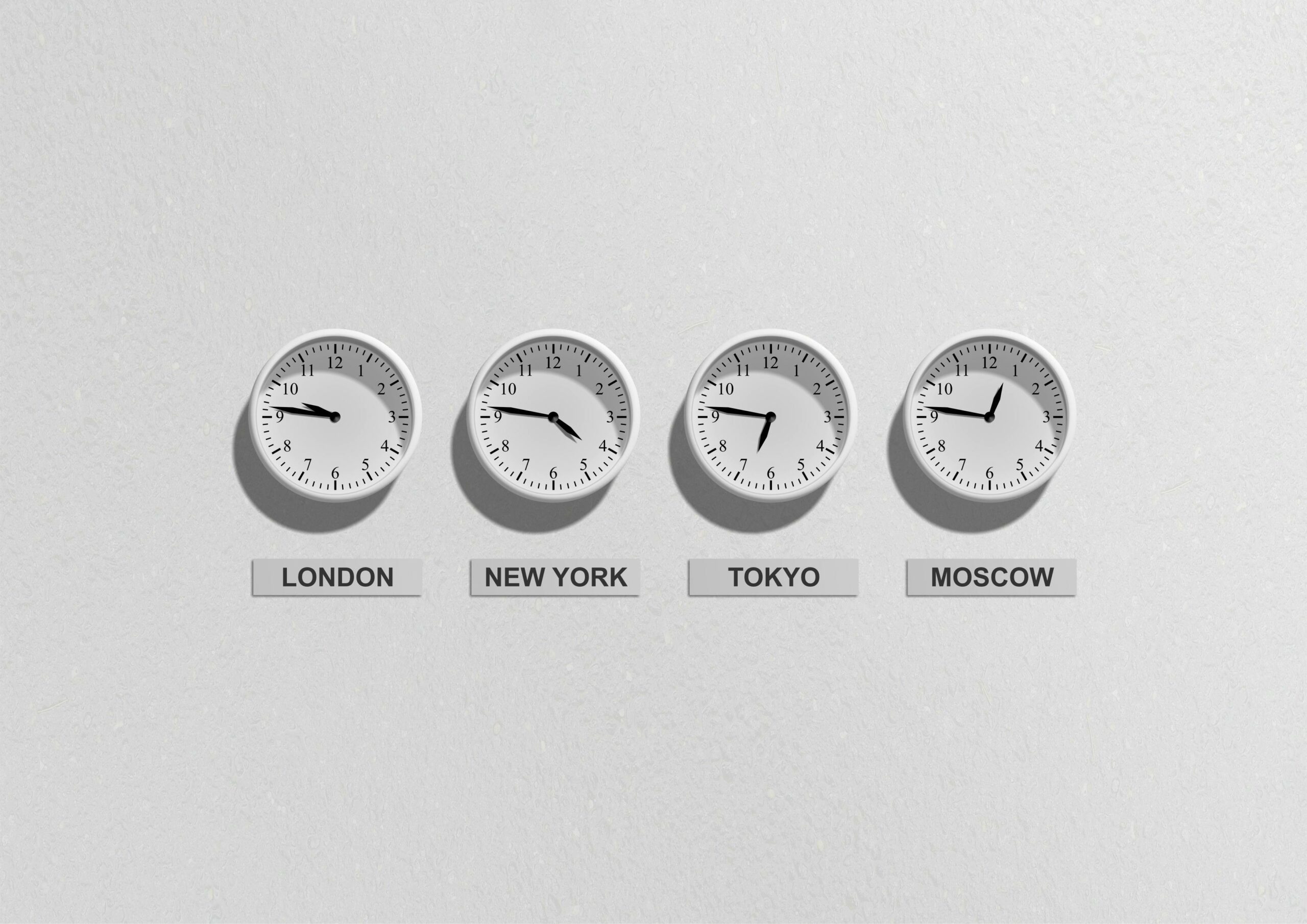 Row of analogue clocks showing time zones for London, New York, Tokyo, Moscow — photo by Pixabay on Pexels
